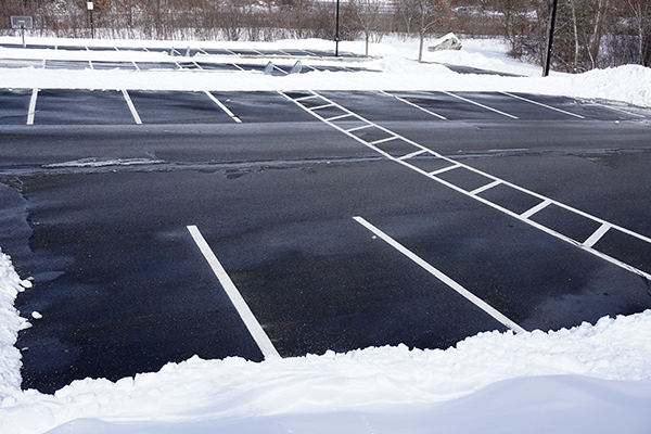 empty parking lot with snow removed